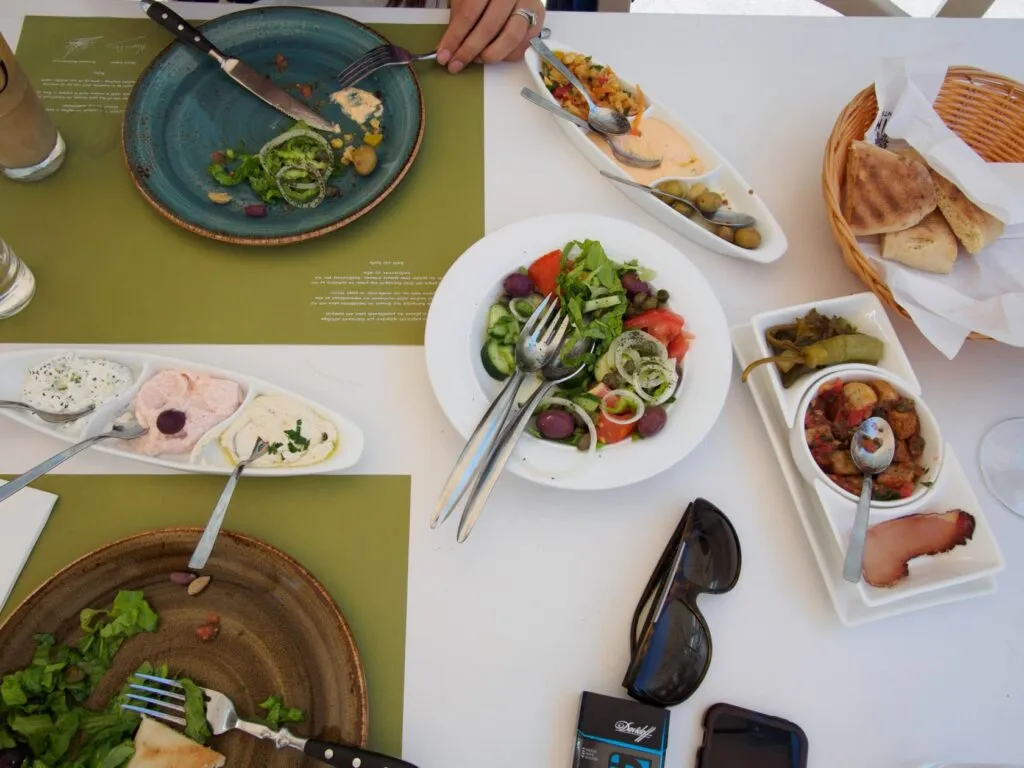 pair The table disappearing under meze plates