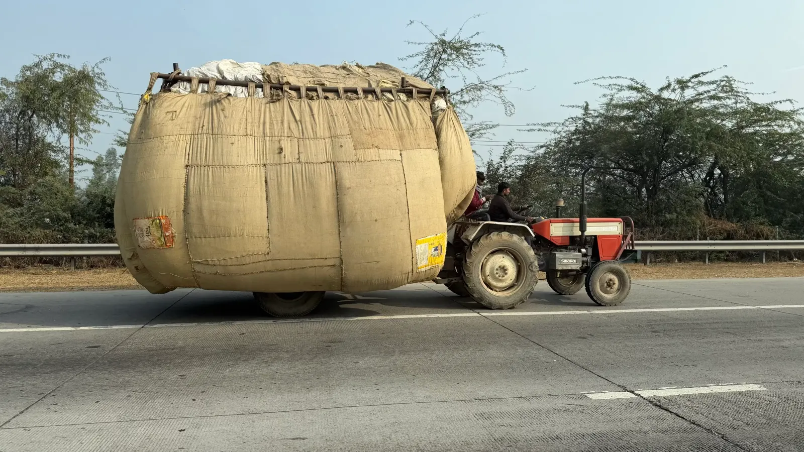 half Overloaded tractor on Indian highway