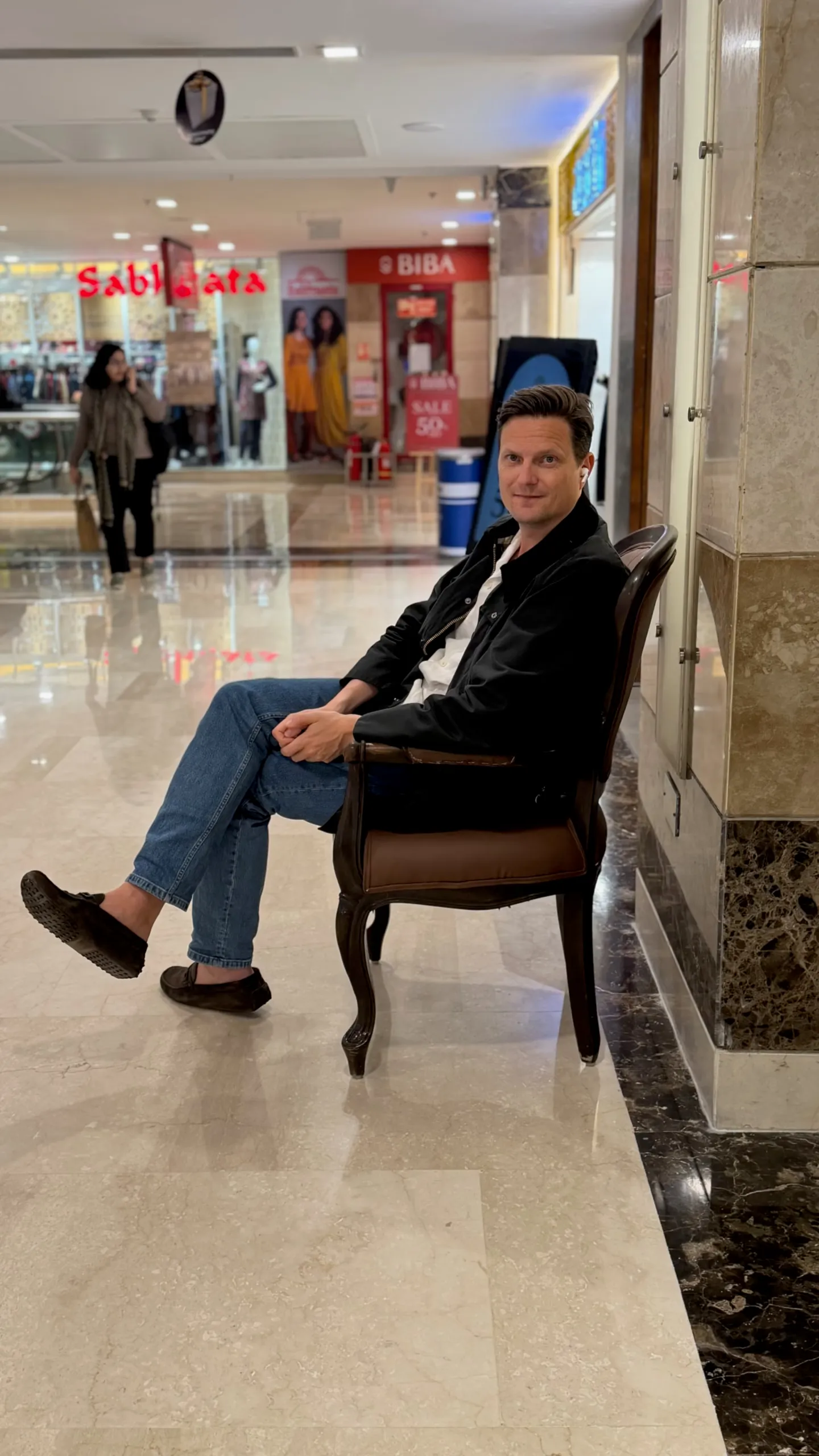 frame Husband chair outside BIBA store in Indian mall