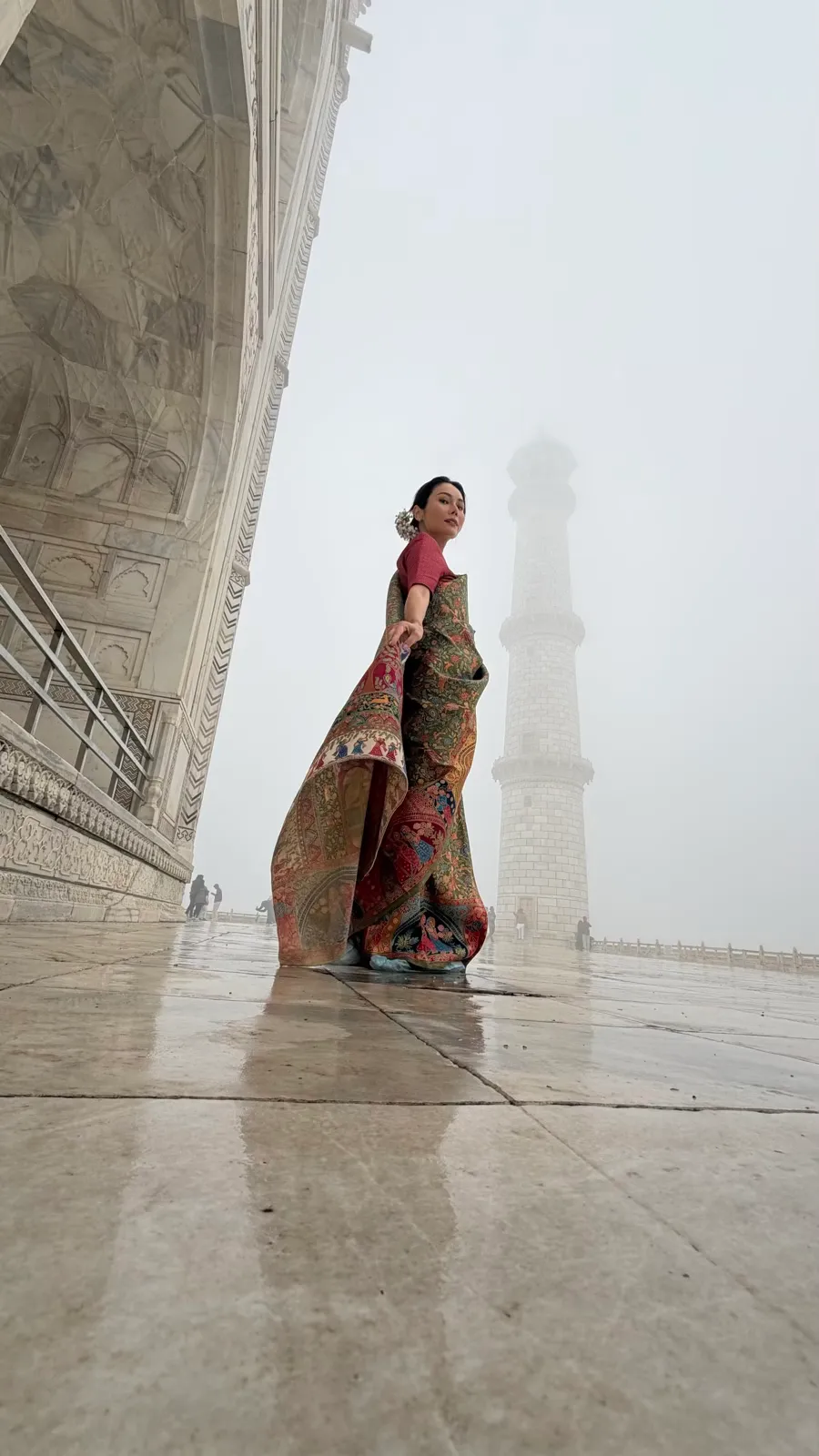 half Woman in sari at Taj Mahal